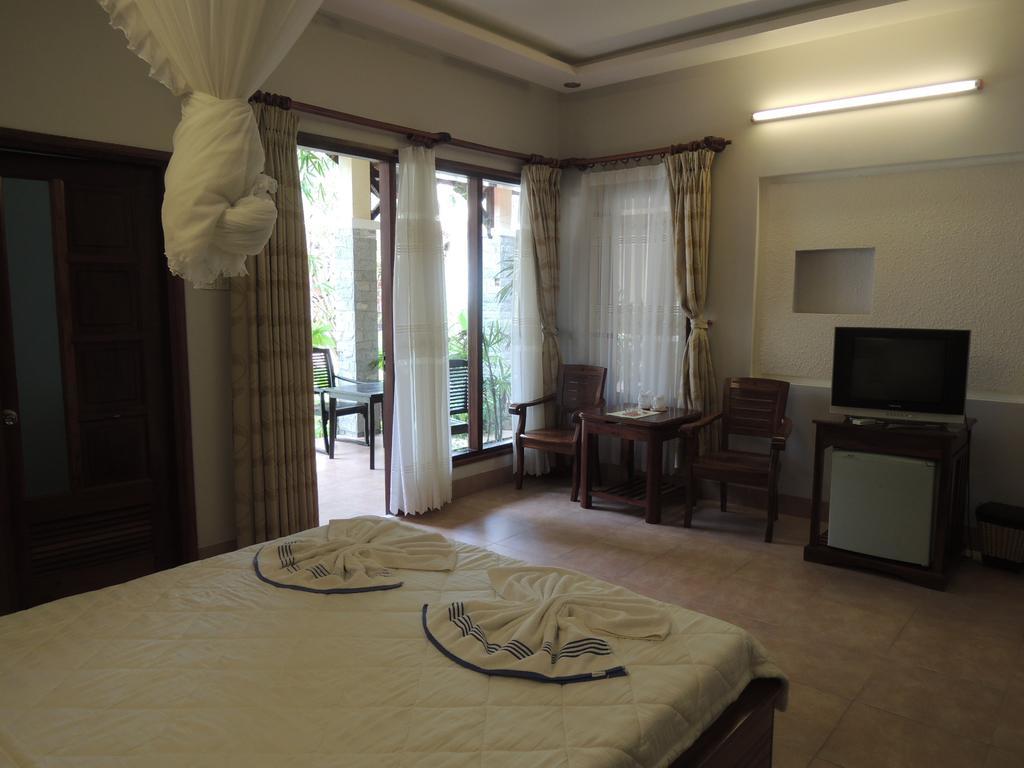 Ngoc Bich Bungalow Hotel Phan Thiet Quarto foto